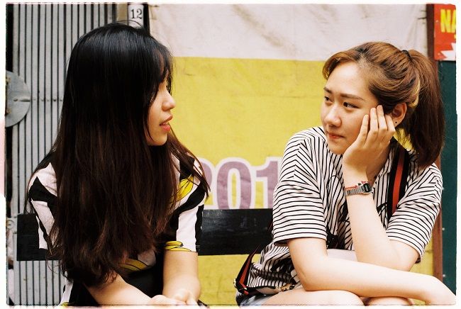 2 women looking at each other and having conversations