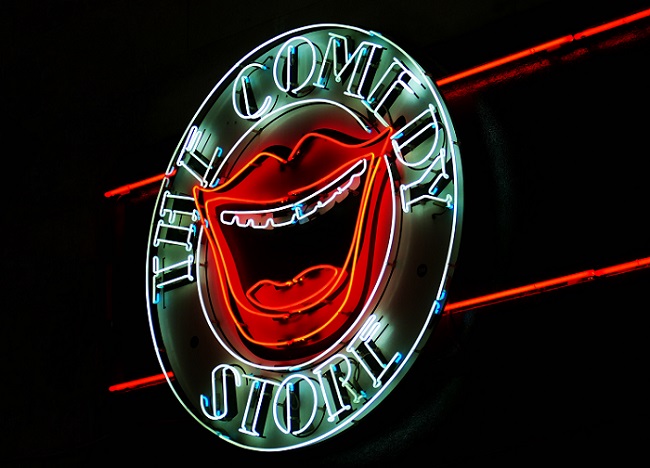 'The Comedy Store' neon sign with red lips and open mouth in the centre