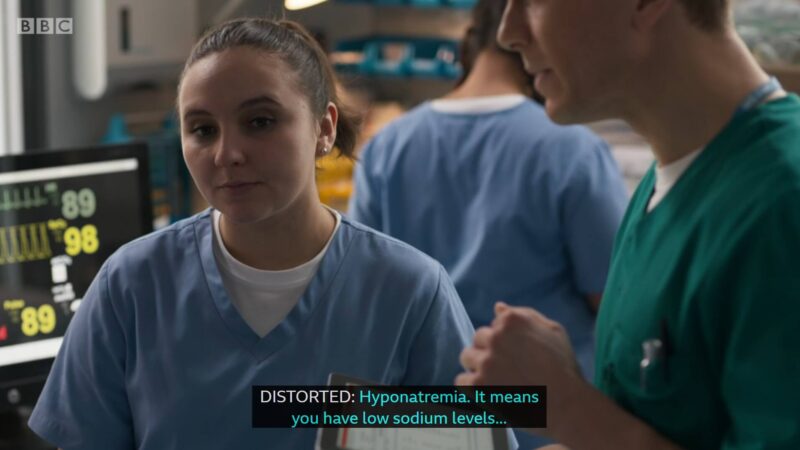 Clip of Casualty episode where Jade is standing beside another nurse and the caption at the bottom is "Distorted: Hyponatremia. It means you have low sodium levels..."