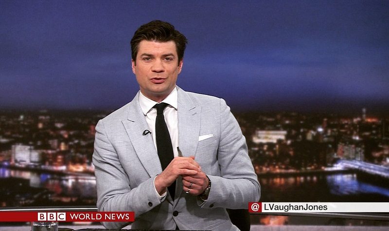 Lewis Vaughan Jones in the BBC World News studio presenting the news live on TV