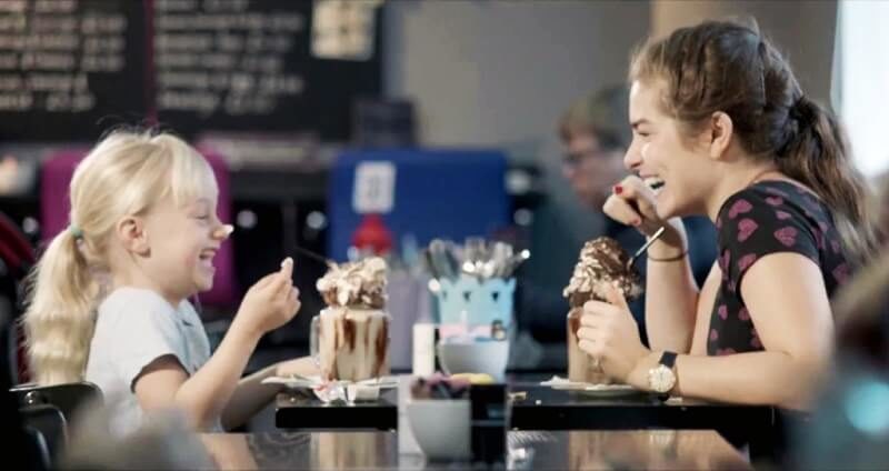 Libby and Joanne from The Silent Child laughing together over ice cream at a cafe