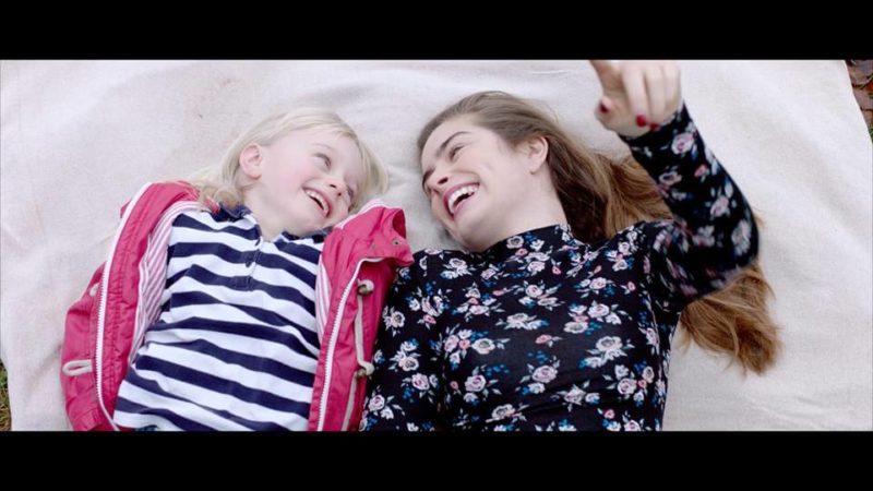 Libby & Joanna from 'The Silent Child' lying down and laughing together